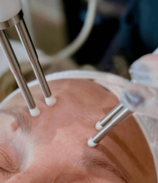 Nicola giving a facial treatment to a customer